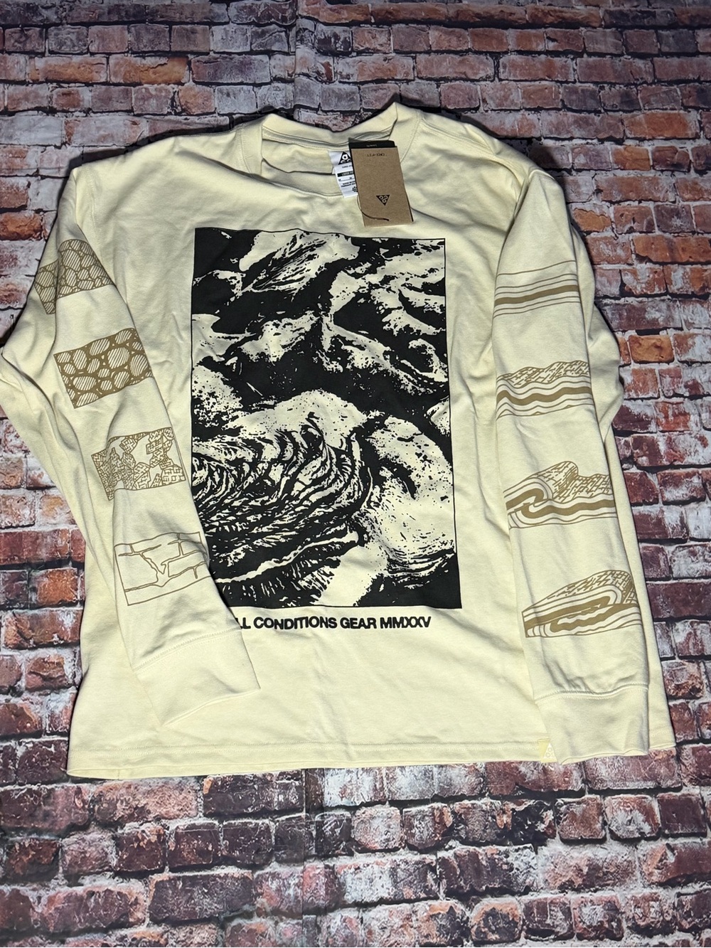 Nike Cream Long Sleeve Graphic Tee with Black Front Print